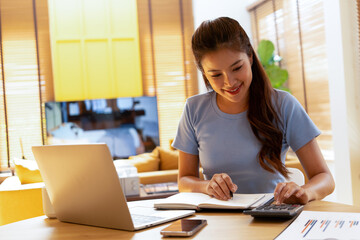 Woman enjoys book and music in modern abode.