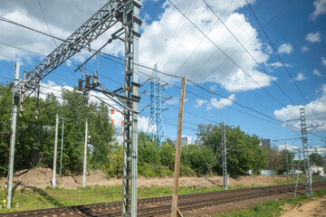 Railway electrical infrastructure with power lines and transmission towers