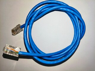 Blue Ethernet Cable coiled up for use in networking and data transmission