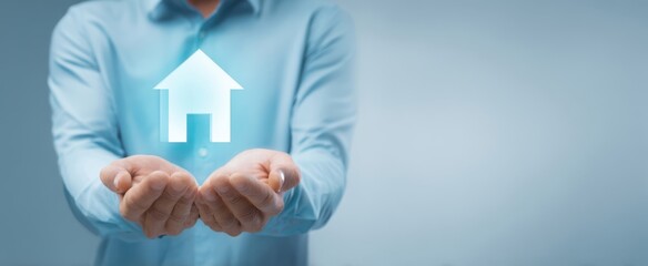 The Hands Holding a House Icon Representing Home Ownership and Investment.