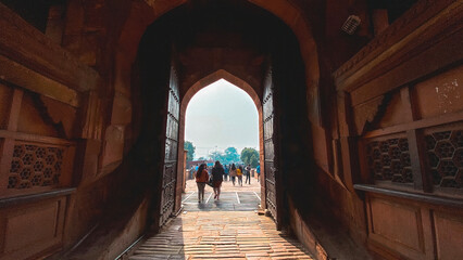 Main entrance gate of Agra Fort, India. Ornate red sandstone gateway showcasing Mughal architecture and intricate carvings.