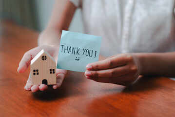 Gratitude business celebrating success with a thank you note office image professional close-up...