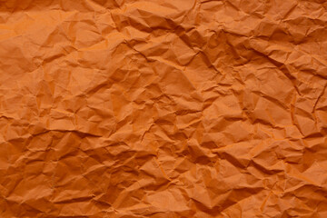 Close-up macro orange crumpled paper texture,Paper Wrinkle Orange Background Abstract Crumpled Old...