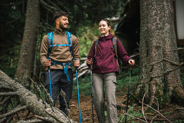 Young Couple Hiking in the Mountains Admiring Nature with Full Gear