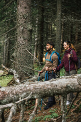 Young Couple Hiking in the Mountains Admiring Nature with Full Gear