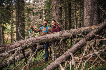 Young Couple Hiking in the Mountains Admiring Nature with Full Gear