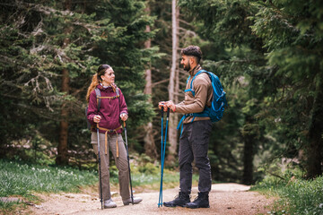 Young Couple Hiking in the Mountains Admiring Nature with Full Gear