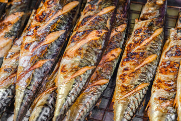 fried fish mackerel, street food, close-up, selective focus