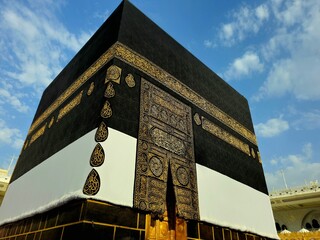 The Kaaba in Ihram Kiswa which is white clothing, in the grand mosque in Makkah, the direction of praying Qibla, Tawaf done around it by pilgrims in Hajj Umrah
