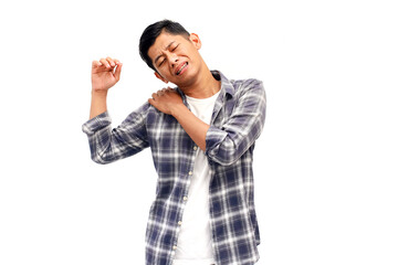 Young Asian man experiencing shoulder pain with a pained expression on his face