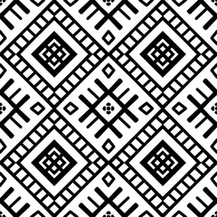 Seamless black and white ethnic pattern. Abstract geometric background with tribal motifs, perfect for textiles, fabric, wallpaper, fashion, and cultural designs.