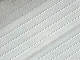 Imitation of painted, textured wood with a diagonal pattern simulating the joints of boards painted...