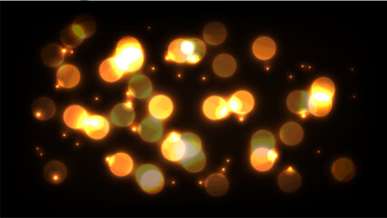Abstract glowing golden bokeh light background on a black backdrop. 