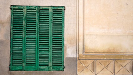 rustic window with shutters slats wood on wall