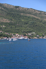 City with a pier for boats and motorboats in the Bay of Kotor Montenegro