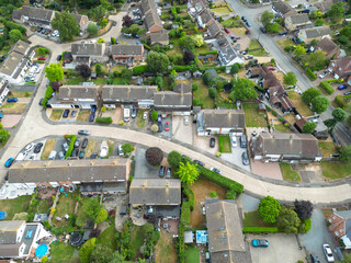 Drone view of a typical English housing estate showing both detached and semi detached houses. The...