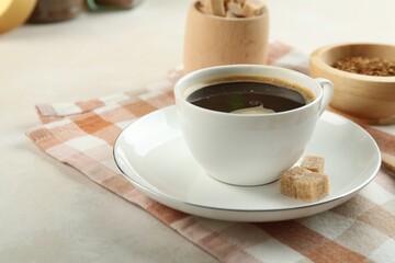 Aromatic instant coffee with sugar on light table, closeup