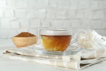 Aromatic instant coffee on light table, closeup