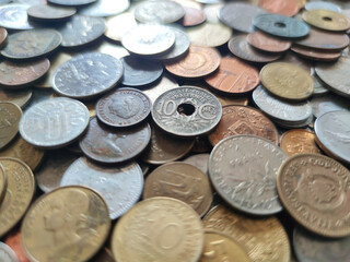 Coins from around the world. Numismatics. Coins background. Heap of various coins. Coins collection.