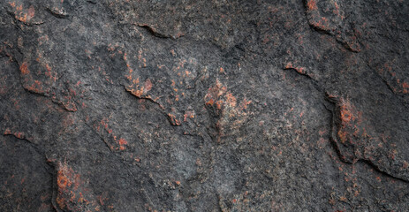 Texture background with the image of a gray granite rock with inclusions of red stone. Can be used for wallpaper, design