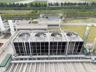 Cooling tower on roof top of building. Industrial air cooling system.