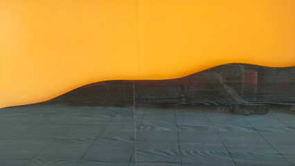 Abstract background featuring a dark, textured, wavy line against a vibrant orange backdrop, creating a modern and graphic visual.