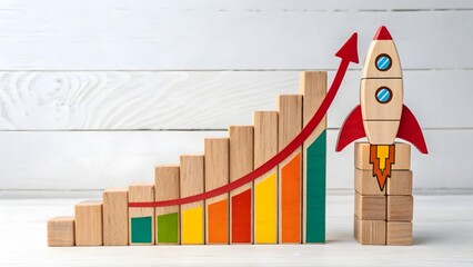Growth and Success Concept with Wooden Blocks and Rocket Design