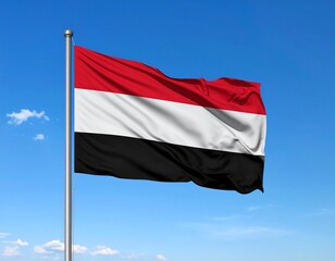 青空の背景にイエメンの国旗