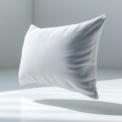 A crisp, high-resolution professional photograph depicting a pristine, blank rectangular pillow suspended horizontally in mid-air, approximately 2-3 inches above a flawless, snow-white floor.