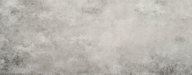 The textured grey concrete surface providing a modern backdrop for design projects.