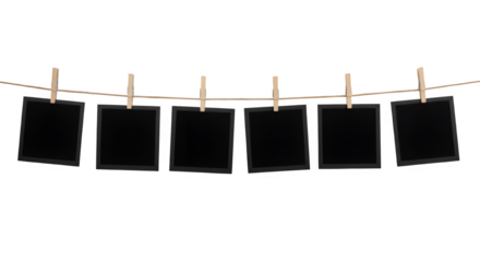 Blank photo frames hanging on a rope with clothespins, perfect for scrapbooking, memory themes, or photo mockups. Isolated on white or transparent background. PNG format.
