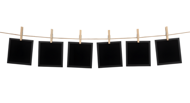 Blank photo frames hanging on a rope with clothespins, perfect for scrapbooking, memory themes, or photo mockups. Isolated on white or transparent background. PNG format.