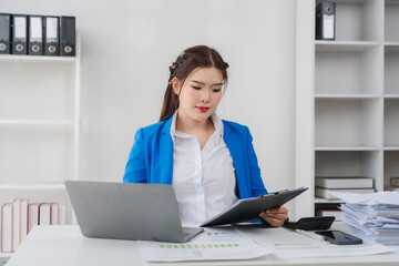 Focused Professional: A determined professional immersed in her work, diligently examining...