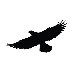 A black silhouette of an eagle is flying with its wings spread, isolated on white background