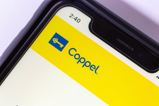 Mexico City, MEXICO - Oct 29 2024 : Close-up of a smartphone displaying the Coppel website, featuring its blue and yellow branding and iconic key logo.
