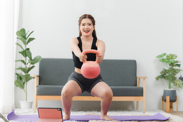 Strength and Wellness: A woman doing kettlebell squats, embodying strength, fitness, and health, a...