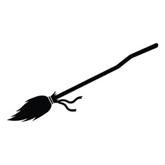 A black silhouette of a witchs broom with tied ribbons is isolated on white background