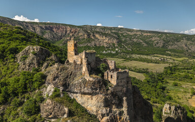 Aerial view of Ruins of Drisi Fortress in Georgia with panoramic mountain and valley views