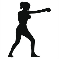 A strong woman in silhouette throws a powerful punch during a boxing workout, showcasing her fitness and determination