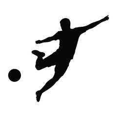 Silhouette of a soccer player kicking a ball in mid air