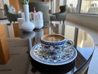 Traditional delicious Turkish coffee or Greek coffee on a table in a cafe
