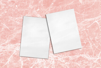 Two invitation cards mockup placed on pink marble stone background, front and back sides, luxury...