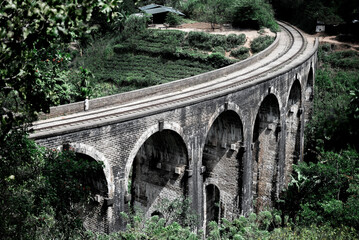 Nine arch bridge in demodara crossing a jungle valley in sri lanka