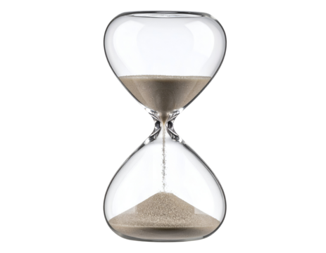 A classic glass hourglass gracefully measures the steady flow of fine sand through its narrow neck.