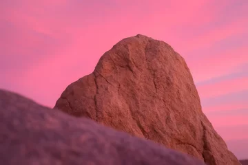 Fototapeten A Lone Mountain Under a Pink Sunset Sky © Oleg