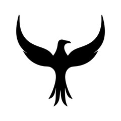 Obraz premium Silhouette of a bird with outstretched wings, symbol of freedom and strength