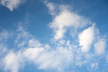 The sky is a vibrant, cloudless blue, while the sun shines brightly, making it appear even more radiant.