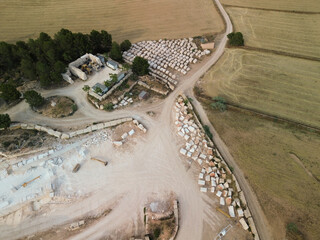 View of a quarry showcasing massive blocks of light‑colored stone