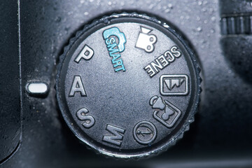 Camera mode dial showing various settings for photography and videography techniques
