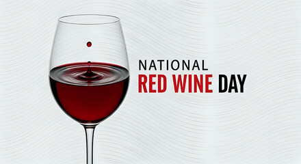 Celebrating national red wine day with a glass of wine and a drop falling into the wine